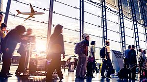 A group of people waiting at the airport to enter Germany